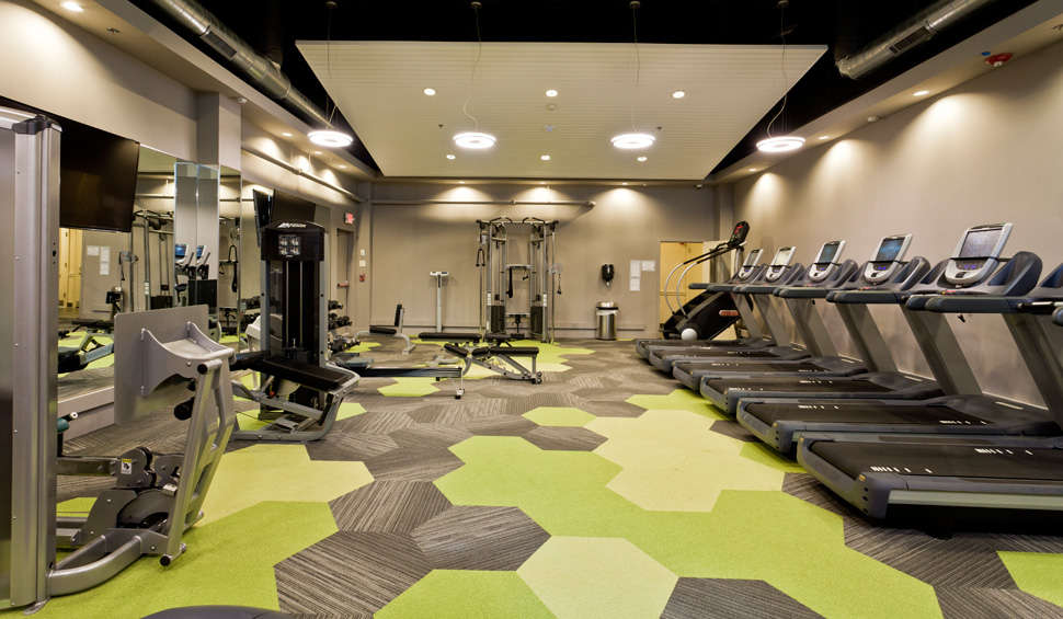 MetroFit Reinhold Residential's apartment fitness center with cardio and weights in Philadelphia